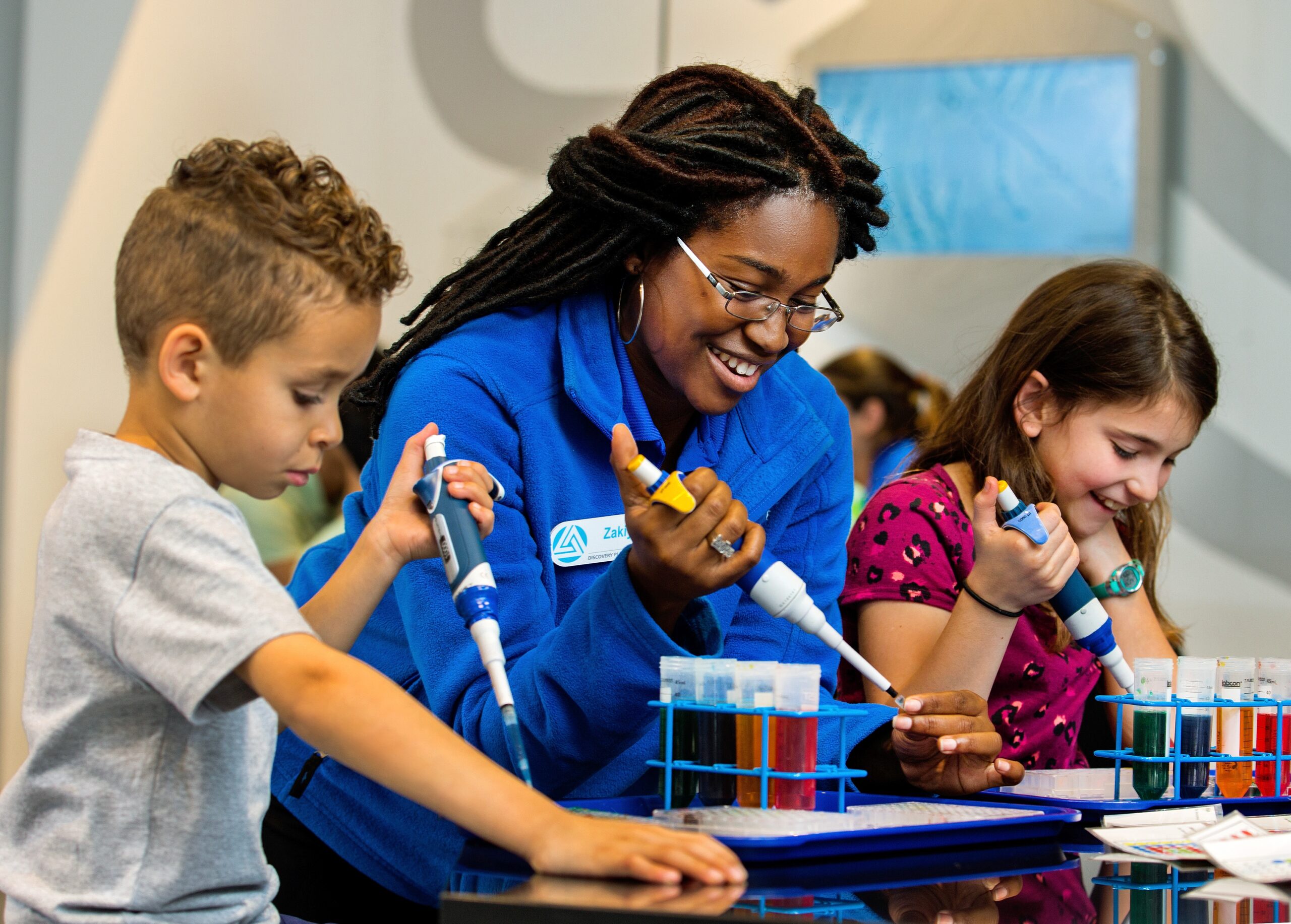 Discovery Place staff member working with children